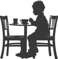 silueta pequeño chico sentado a un mesa en el café negro color solamente vector