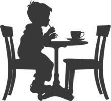 silueta pequeño chico sentado a un mesa en el café negro color solamente vector