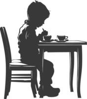 Silhouette little boy sitting at a table in the cafe black color only vector