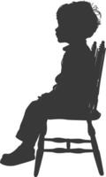 Silhouette little boy sitting in the chair black color only vector