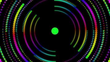 Vibrant neon circle with a vivid green center against a dark background video