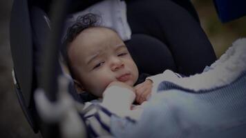 Young Baby Boy Lying in pram buggy Waking up after Sleeping video