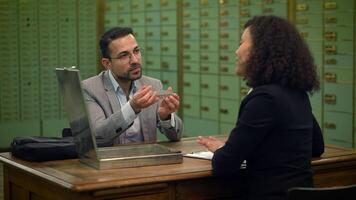 Businessman Looking at Silver Bar Bullion Discussing Protecting Investment video