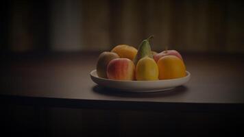 A bowl of fruit sits as natural ingredients on the table video