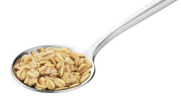 Granola, crunchy muesli in spoon isolated on white background photo