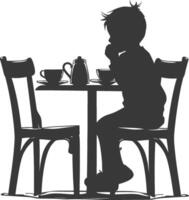 Silhouette little boy sitting at a table in the cafe black color only vector