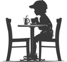 silueta pequeño chico sentado a un mesa en el café negro color solamente vector