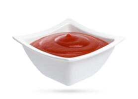 Ketchup bowl isolated on white background. photo