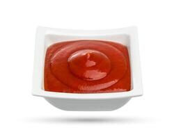 Tomato sauce or ketchup isolated on white photo