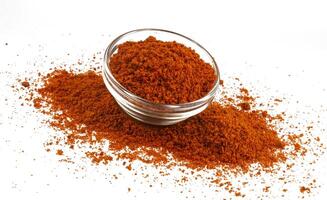 Pile of red paprika powder isolated on white background photo