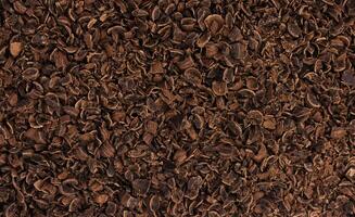 Grated chocolate texture. Ground chocolate background photo