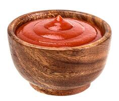 Ketchup or tomato paste in bowl isolated on white photo