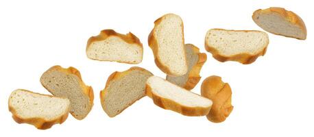 Falling slices of white bread isolated on white background photo