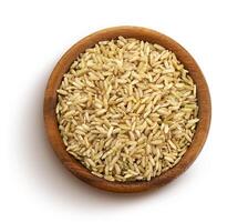 Brown rice groats isolated on white background, top view photo