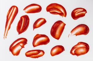 Ketchup stains and splashes isolated on white background photo