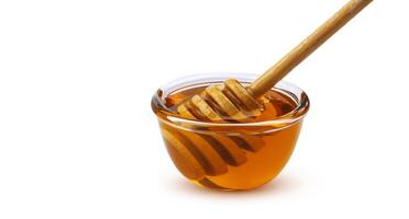 Honey stick and bowl of honey isolated on white background with clipping path photo