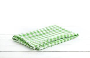 Table with green tablecloth for product montage photo