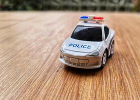 Close up bokeh photo of a boy's toy police car.