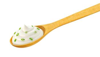 Sour cream in wooden spoon isolated on white photo