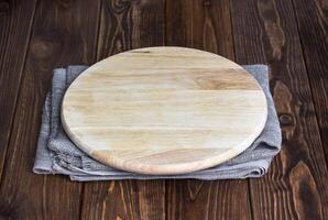 Table with round cutting board for product montage photo