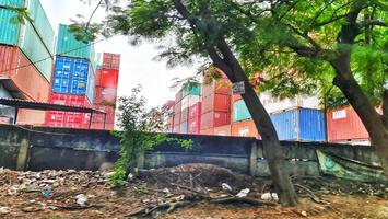 Jakarta, Indonesia on December 6, 2023. Stacks of colorful containers at a logistics warehouse in Cakung. photo