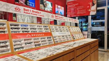 Bekasi, Indonesia on December 12 2023. Several glasses are neatly arranged in an glasses shop window. photo