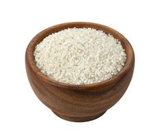 Crushed rice in wooden bowl isolated on white background photo