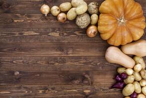 vegetables harvest on wooden table background photo