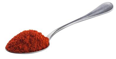 Pile of red paprika powder in spoon isolated on white background with clipping path, ground red pepper spice photo