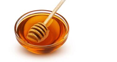 Honey stick and bowl of honey isolated on white background with clipping path photo