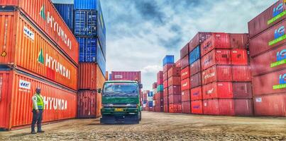 Jakarta, Indonesia on December 6, 2023. Stacks of colorful containers at a logistics warehouse in Cakung. photo