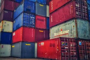 Jakarta, Indonesia on December 6, 2023. Stacks of colorful containers at a logistics warehouse in Cakung. photo