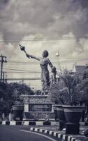 Jepara, Indonesia on January 21, 2024. A crossroads in Jepara where in the middle there is a statue of Our Lady Kartini. photo