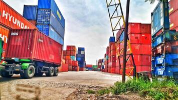 Jakarta, Indonesia on December 6, 2023. Stacks of colorful containers at a logistics warehouse in Cakung. photo