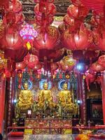 Bangkok, Thailand on July 22 2023. Statues of Buddha and Gods inside Wat Mangkon Kamalawat for Buddhist worship photo