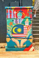 Kuala Lumpur, Malaysia on May 22, 2023. An electrical panel decorated with paintings of the Malaysian flag and landmarks. photo