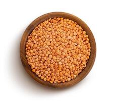Red lentils isolated on white background, top view photo