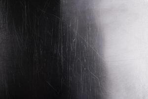 Old metal background, brushed metal texture with scratches photo