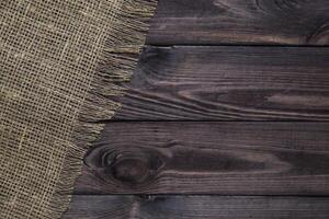 Burlap texture on wood table background photo