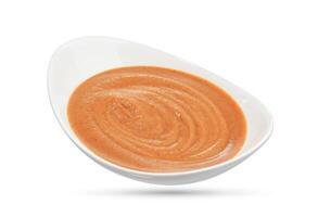 Pink sauce in a bowl isolated on white photo