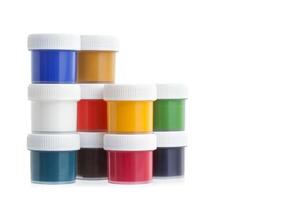 Colorful gouache paint cans isolated on white photo