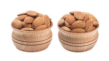 Almond nut in wooden bowl isolated on a white background photo
