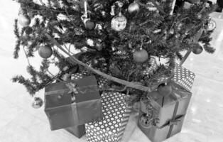 Pile gifts under the Christmas tree. Merry Christmas. Colorful gifts. photo