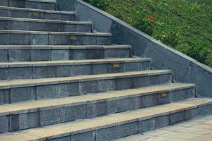 Stairs with natural gray stone with a slightly rough texture, photo