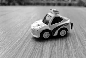 Close up bokeh photo of a boy's toy police car.