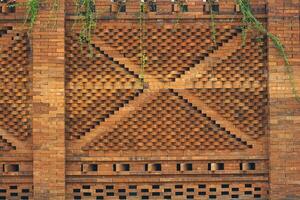 The arrangement of the bricks arranged in such a way forms a very beautiful building wall photo
