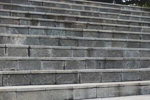 Stairs with natural gray stone with a slightly rough texture, photo