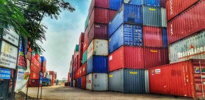 Jakarta, Indonesia on December 6, 2023. Stacks of colorful containers at a logistics warehouse in Cakung. photo
