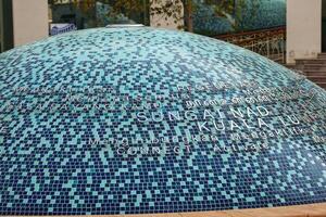 Kuala Lumpur, Malaysia on May 21, 2023. A semi-circular monument in the middle of the front of the Kuala Lumpur Library. photo