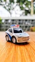 Close up bokeh photo of a boy's toy police car.